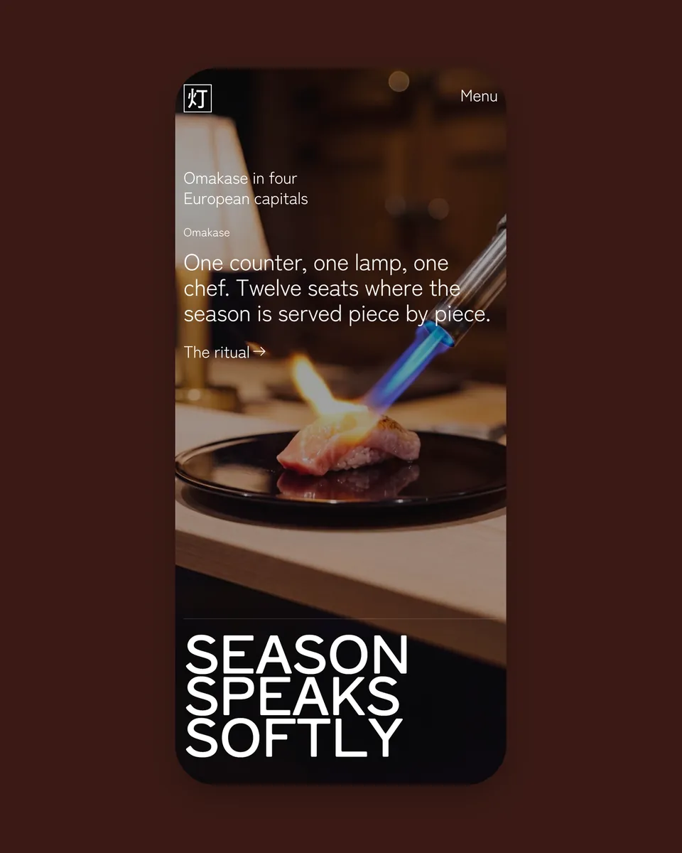 TŌKA's home page on a phone: the flamed nigiri and “Season speaks softly”